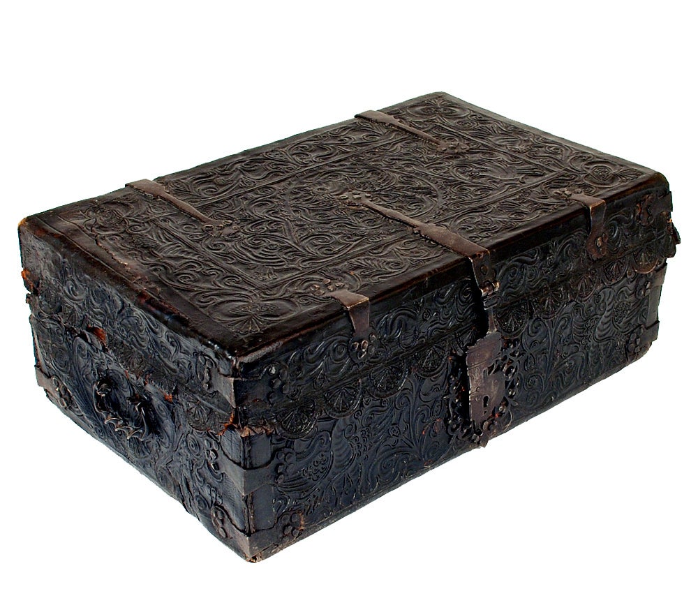 A superb early 18th century hand tooled and embossed leather Spanish colonial petaca (document box) with beautiful hand forged iron hasp, hinges and lock-plate. Overall with a rich and lustrous surface patina. The interior lined in very early