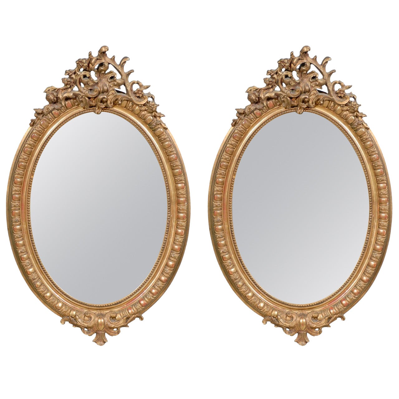 Pair of 19th Century Rococo Revival Oval Giltwood Mirrors