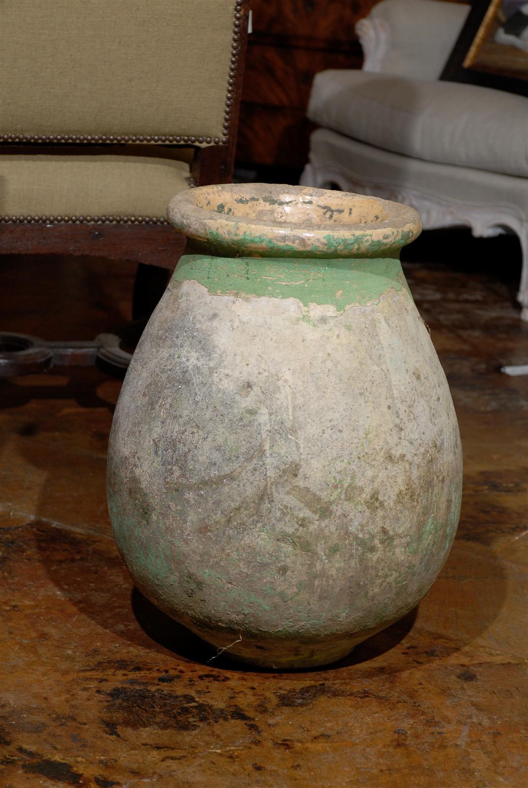 French olive jar made in Biot, Provence, France in the mid to late 19th C.  Great patina and an attractive green glaze.  A drainage hole has been drilled in the bottom.