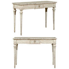 Pair of pale gray painted classical Louis XVI style consoles.