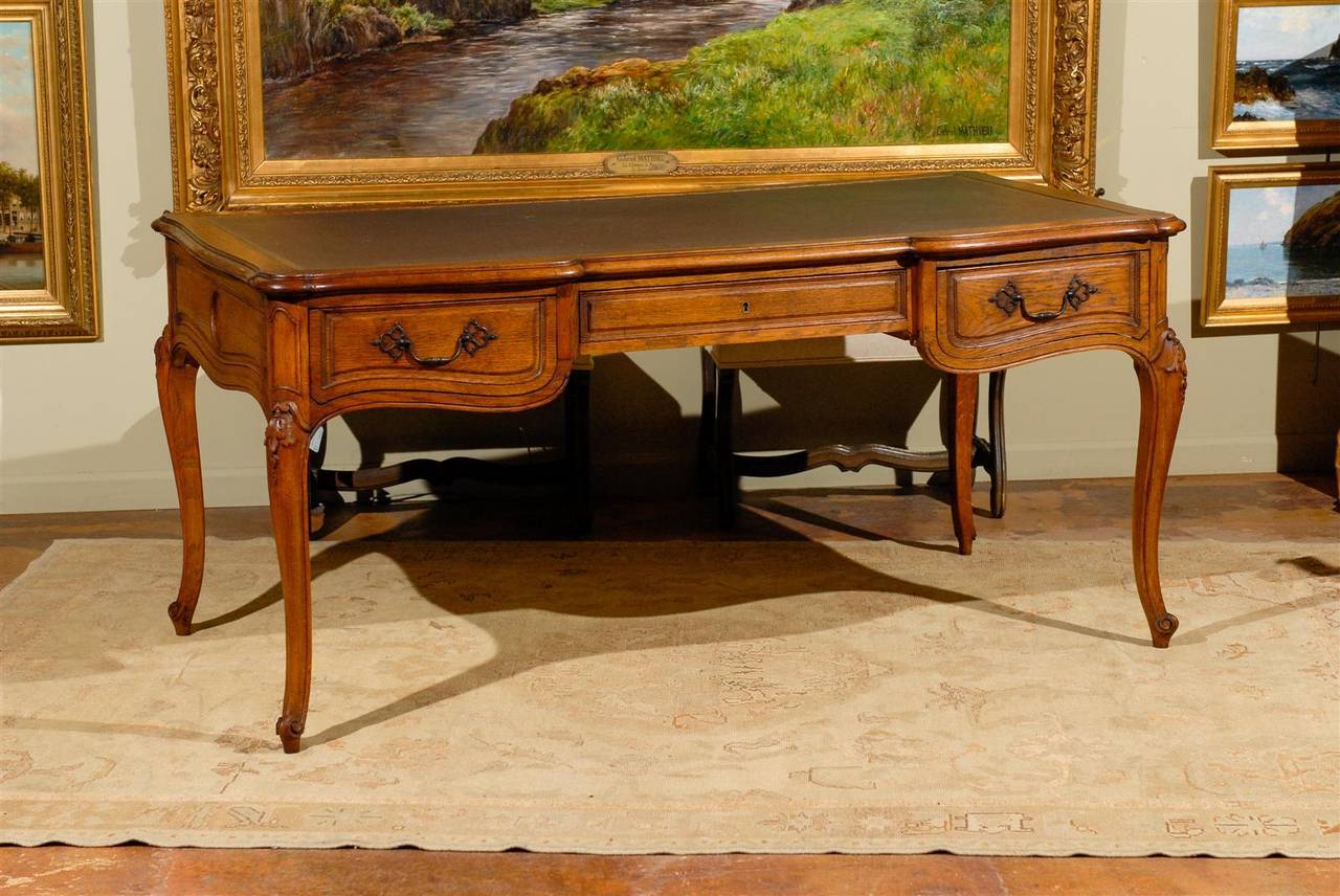 Leather top bureau plat with three drawers found in Mercier Freres, Paris.