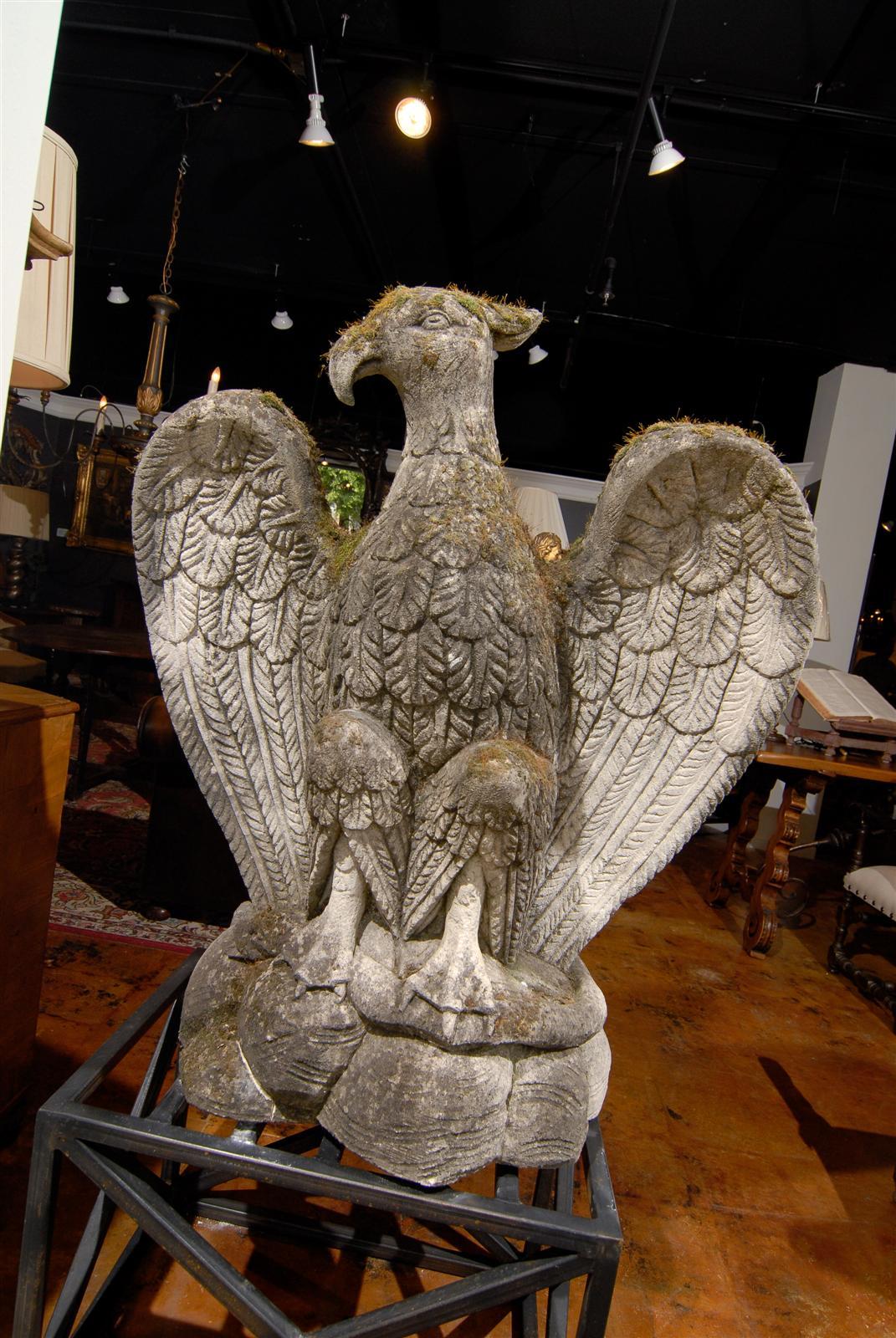 Handsome cast limestone bird with snake in talons, circa 1890.