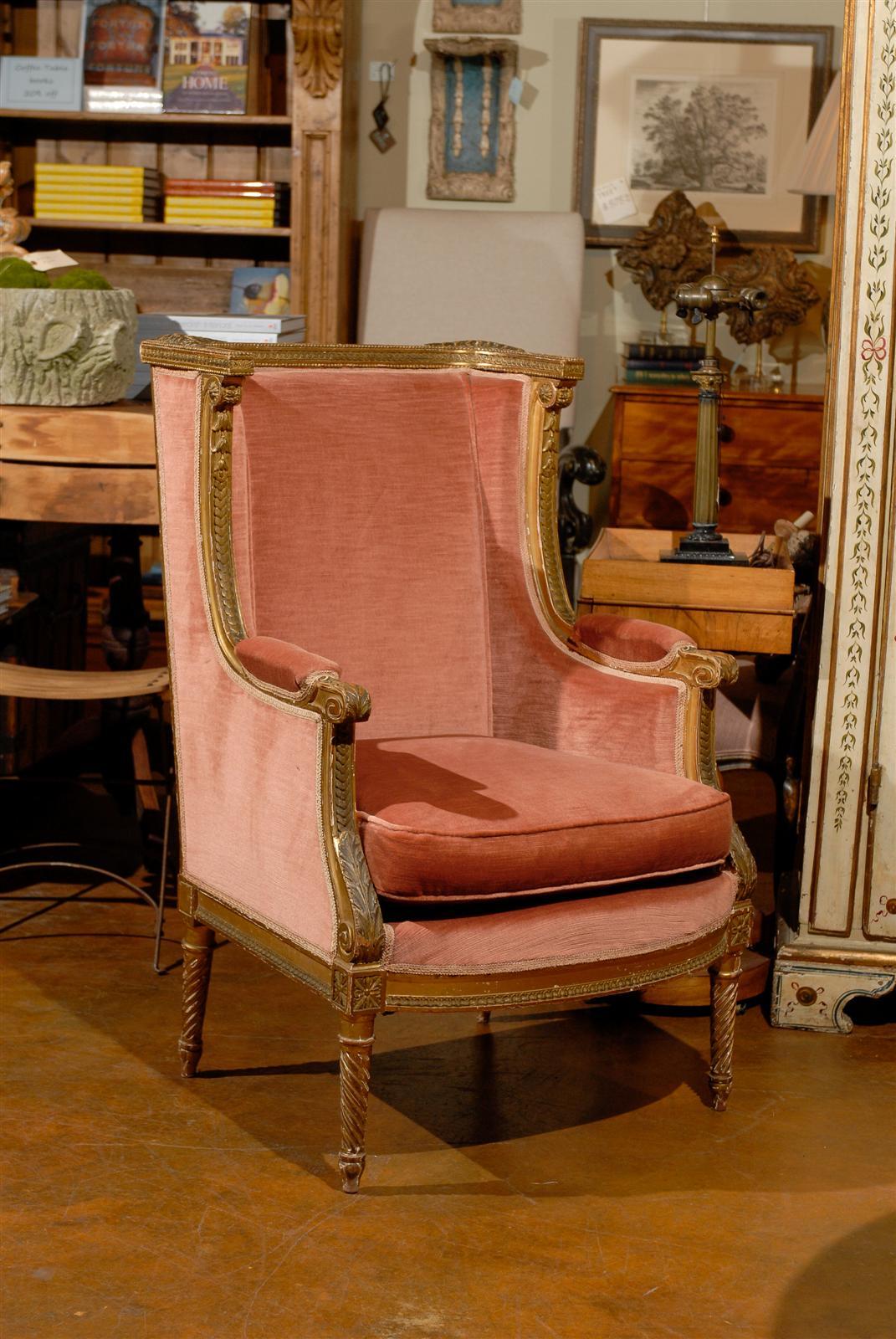 Early 19th century Italian full backed bergère, the rectangular back surmounting a square seat and raised on turned fluted legs, upholstered in a light pink velvet.