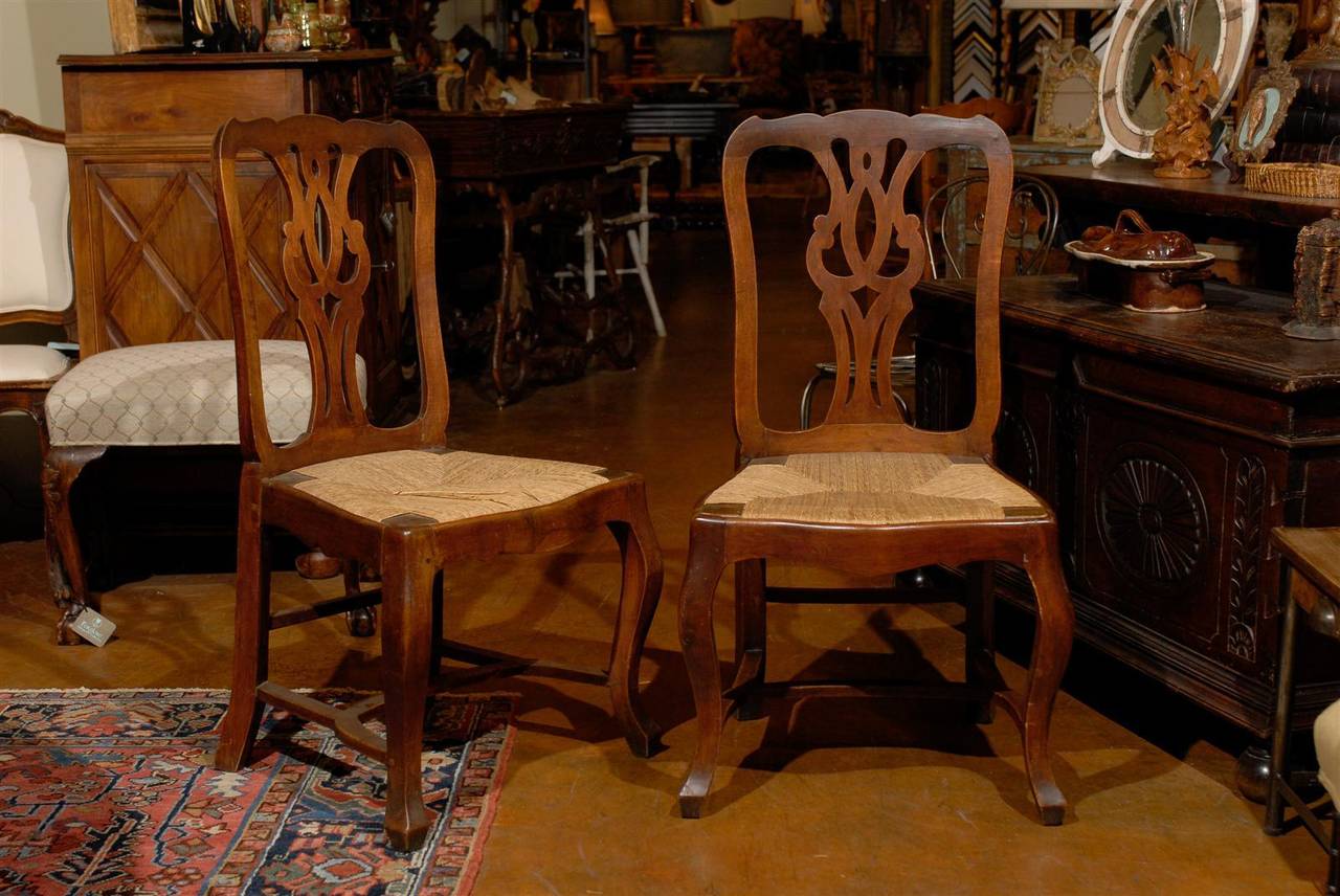 Set of six French chairs with rush seats in walnut, 19th century.