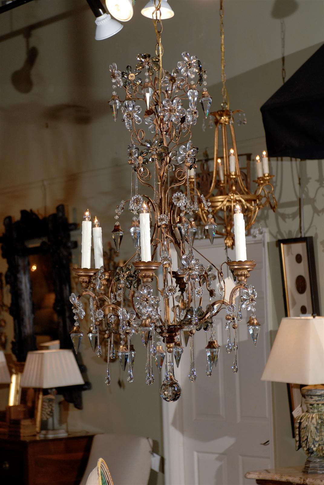 Mid-19th century Italian crystal and iron six-light chandelier, with floriform and tear drop prisms throughout and six scrolling arms.