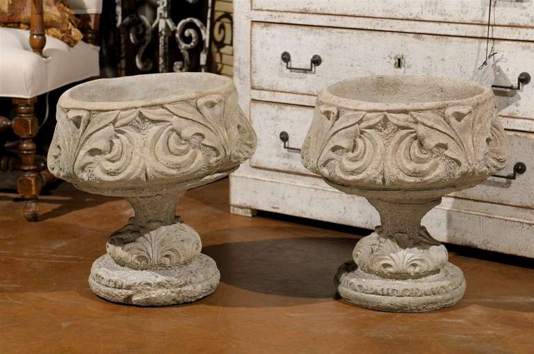 Pair of urns with lovely acanthus leaf motifs.