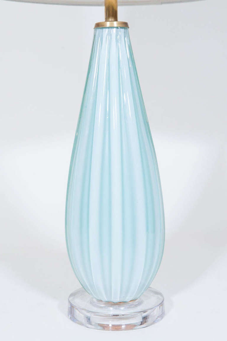 A beautiful pale sea blue Murano table lamp with new lucite base updates this worldly classic. Rewired. Shade available.