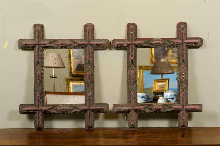 Pair of 20th century Tramp Art frames surrounding rectangular mirrors.