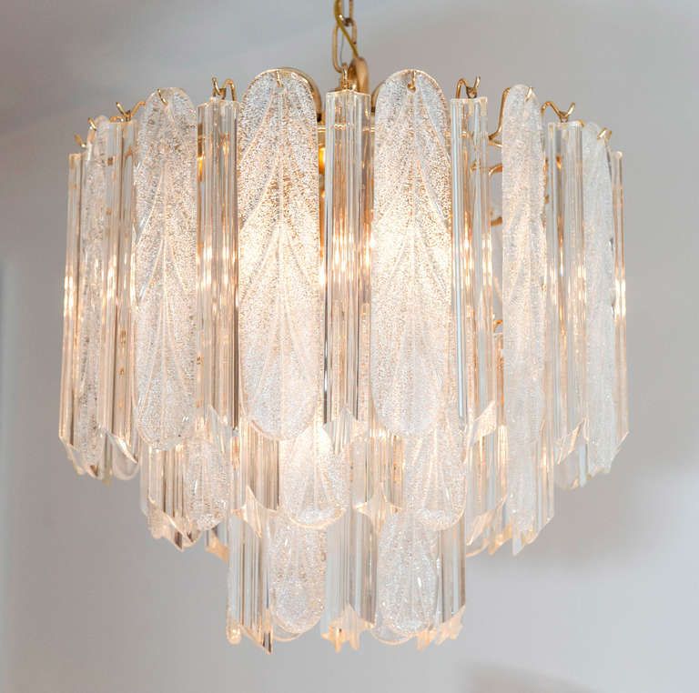 This sparkling light fixture with
alternating clear crystal prisms and frosted glass drops is perfect for that transitional-modern hall or powder room space.
The frame can be nickel plated at an additional cost.