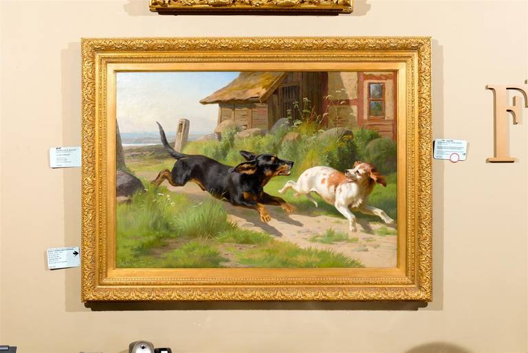 Oil on canvas depicting a dachshund and terrier playing a game of tag, by Adolf Henrik Mackeprang (Danish, 1833-1911).