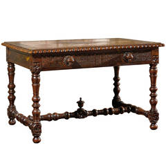 Carved French Table with Four Drawers and Birds Head Knobs