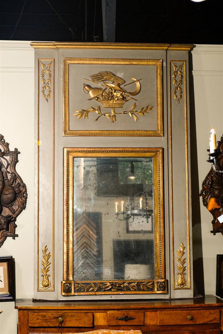 19th century large French giltwood paint decorated trumeau mirror, the rectangular crest with central gilt carvings of a dove and fruit basket flanked by two pilasters, all surrounding a rectangular mirror with separate giltwood border.