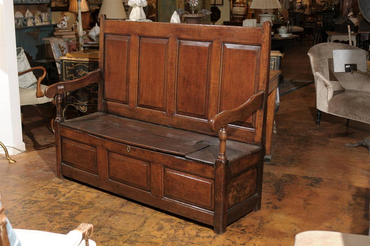 Handsome English oak settle with storage.