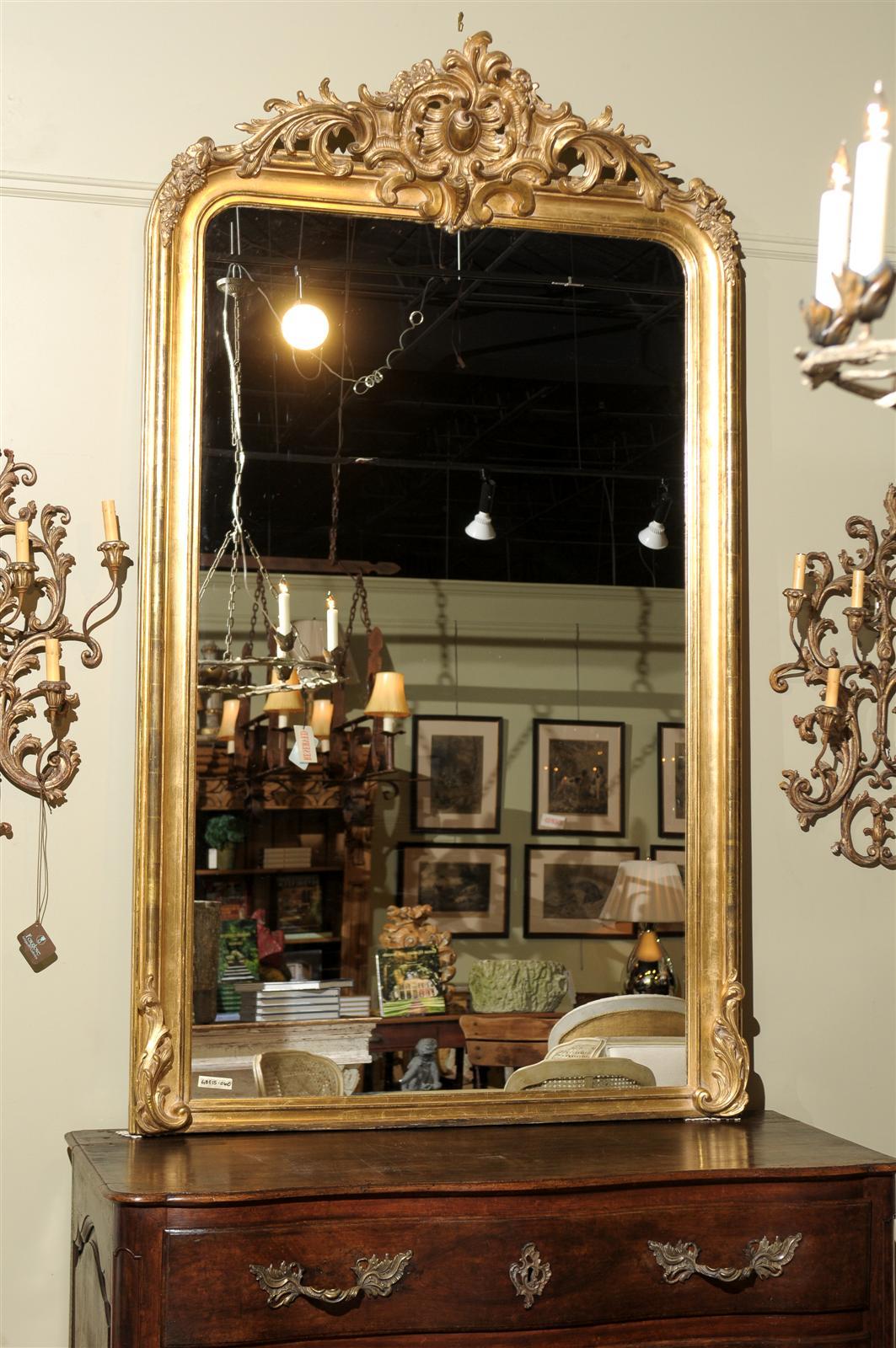 Beautiful 19th century gilt frame with carved crest, new mirror glass.
