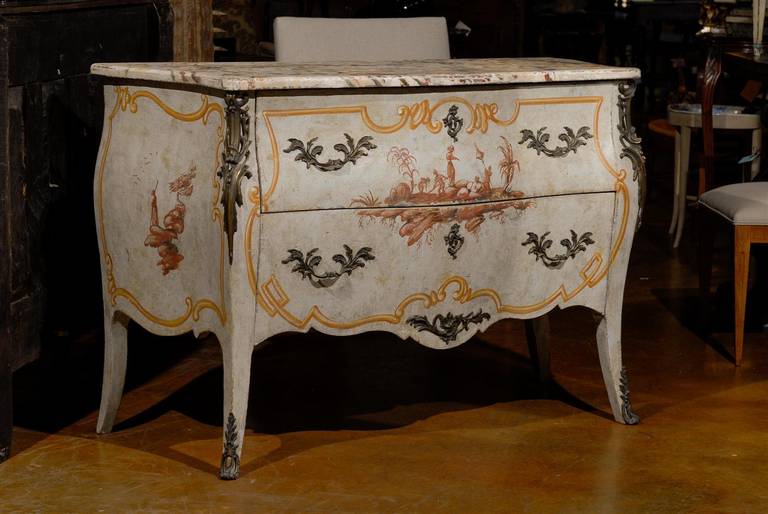Louis XV style paint decorated bombe chest, with all over chinoiserie decor, the marble top surmounting two long drawers, raised on cabriole legs. 