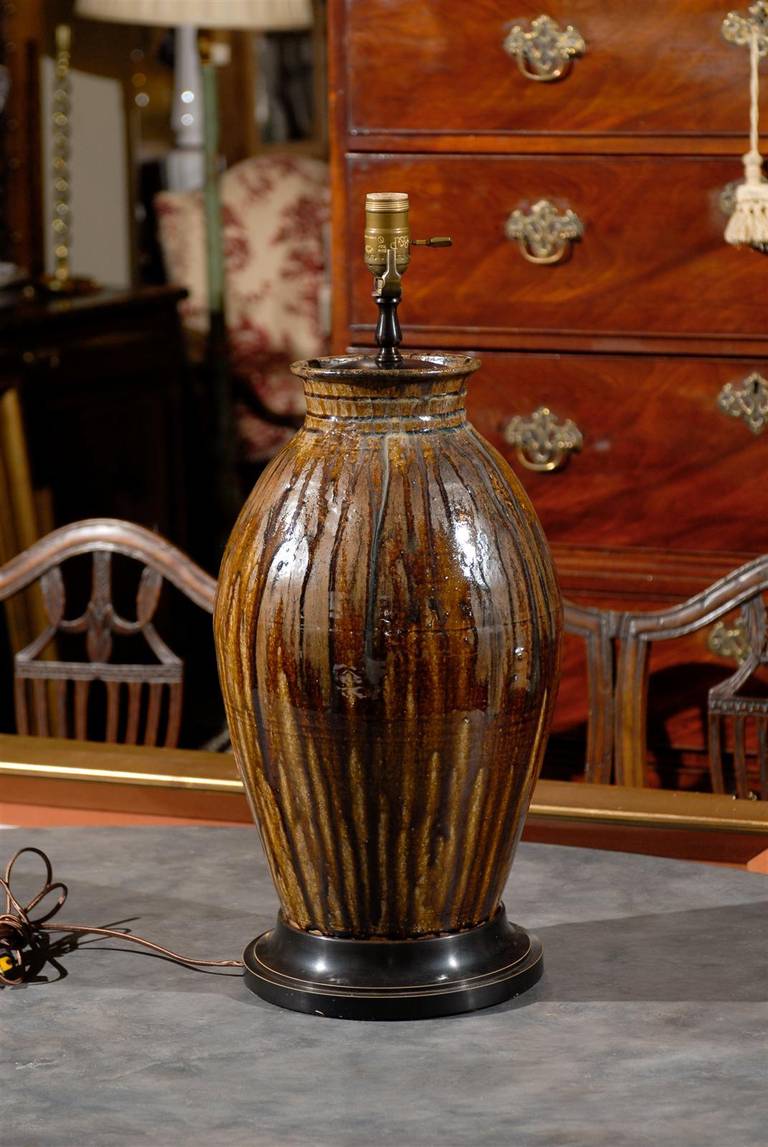 Handmade North Carolina ceramic urn as lamp, with an alkaline drip glaze. 