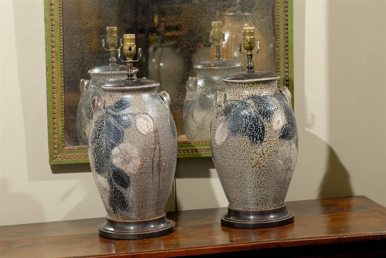 Pair of North Carolina studio pottery urn lamps with lug handles and salt glaze with floral decoration.  Handmade, new.