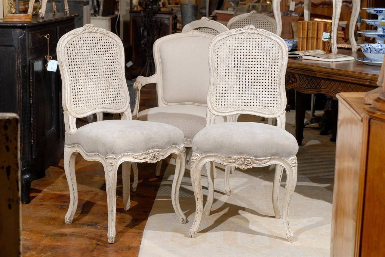Set of six French cane chairs.