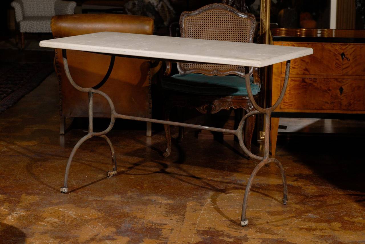 Antique iron pastry table with marble top.
