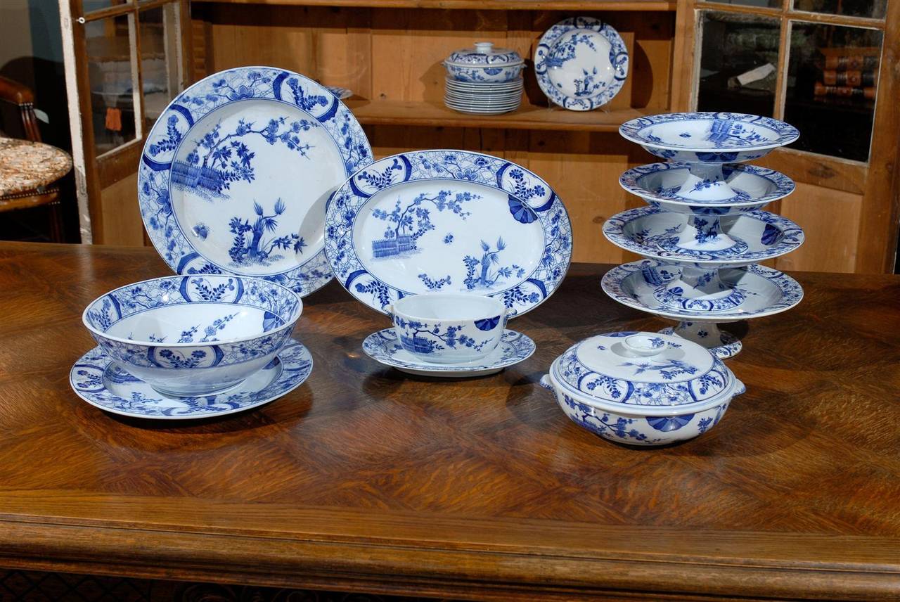 A set of 85 French Creil and Montereau transfer-printed Japonisme blue and white porcelain dinnerware, designed by Claude Monet in the mid-19th century. Featuring an exquisite 85-piece set of dinnerware, the Japan influenced pattern was designed and
