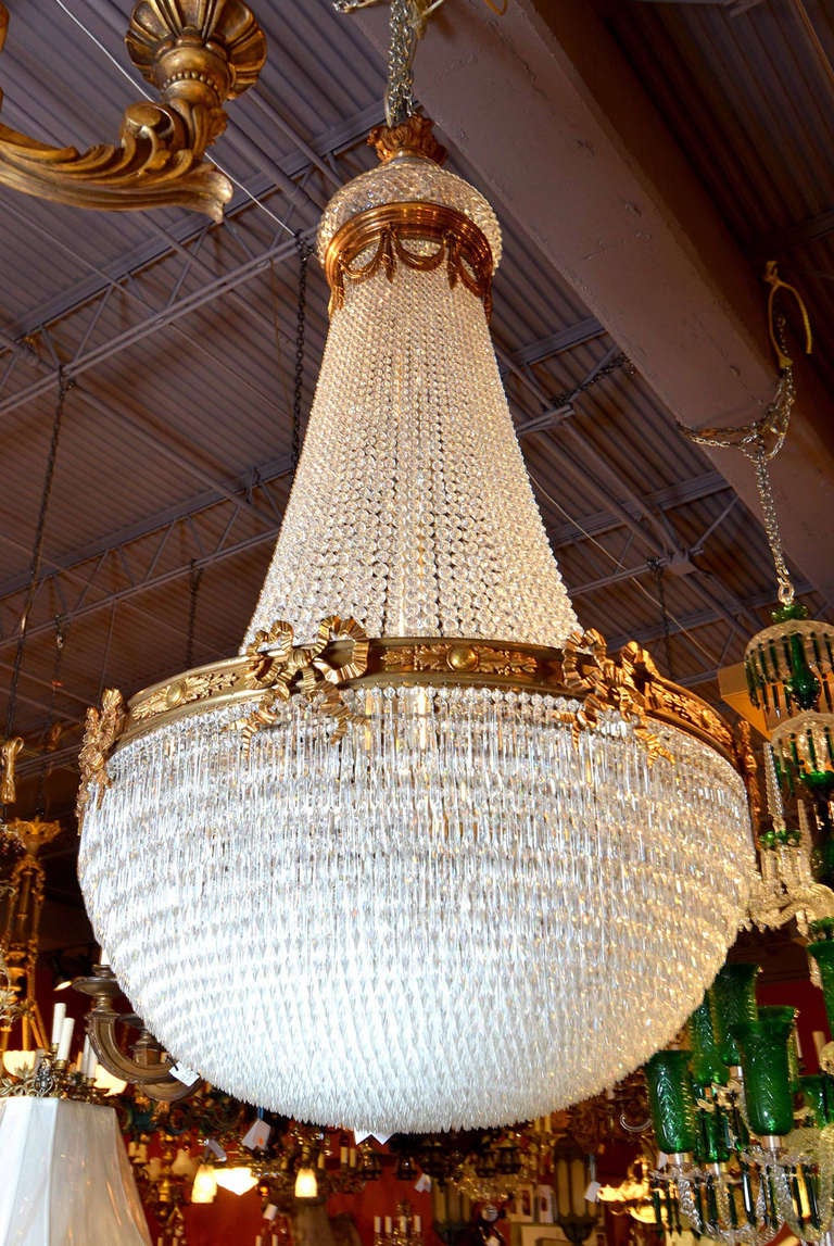 Beautiful gilt bronze and crystal basket style chandelier by Baccarat.