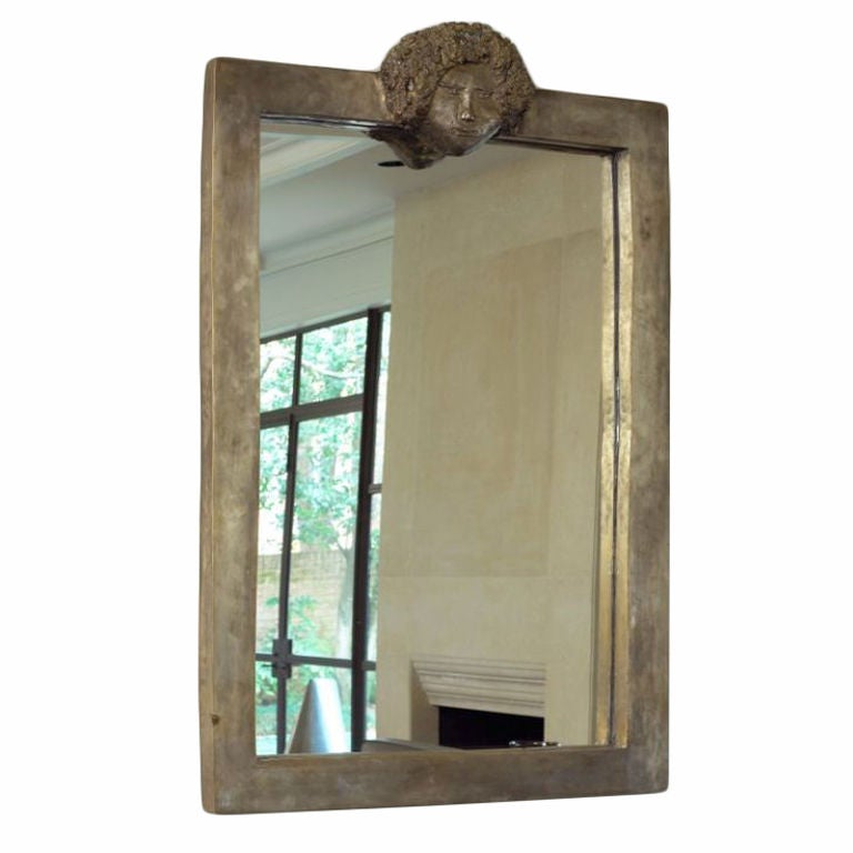 Laurent Chauvet rectangular mirror in silvered patina with relief of African female
