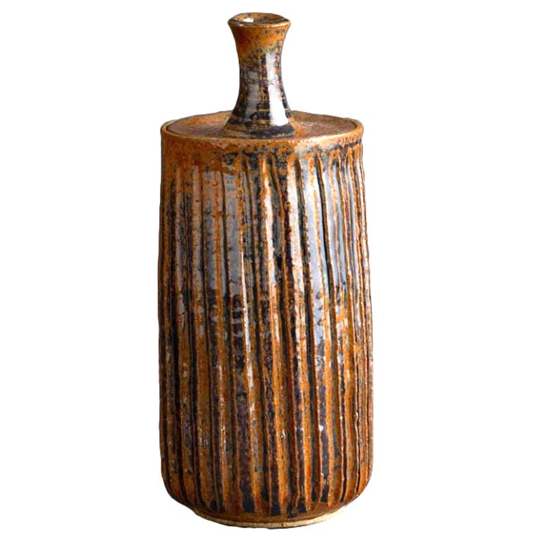 Tom McMillian orange ceramic striated vessel with lid