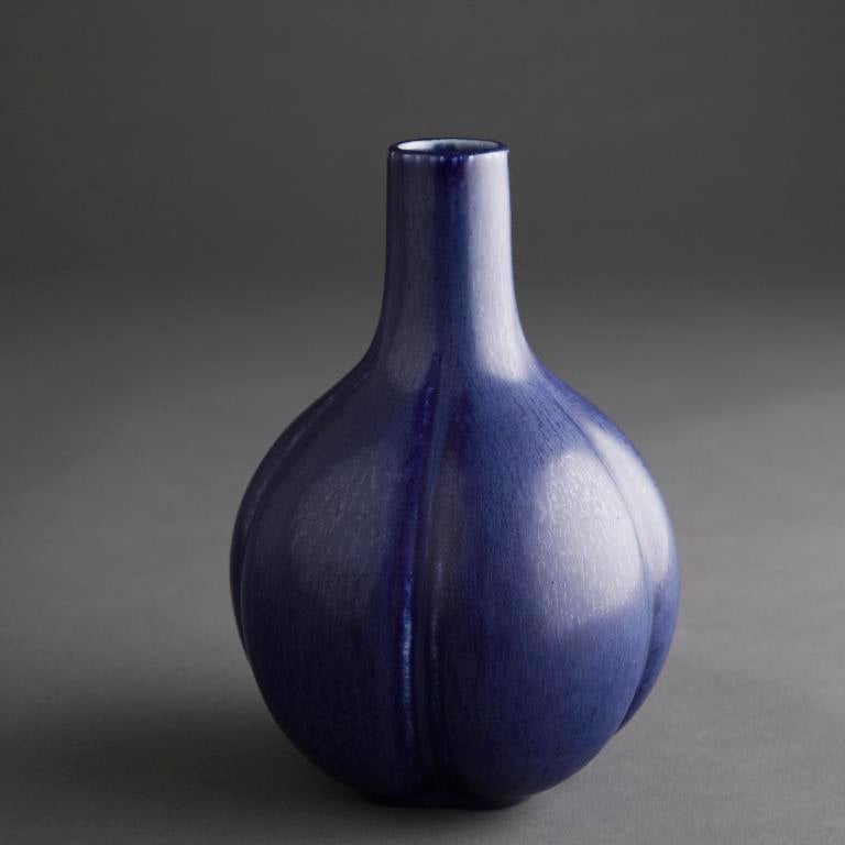 Saxbo blue ceramic vase iwth bulbous bottom on olongated neck.