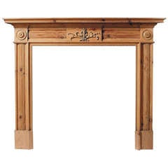 A Carved Pine Chimneypiece in the Regency Style