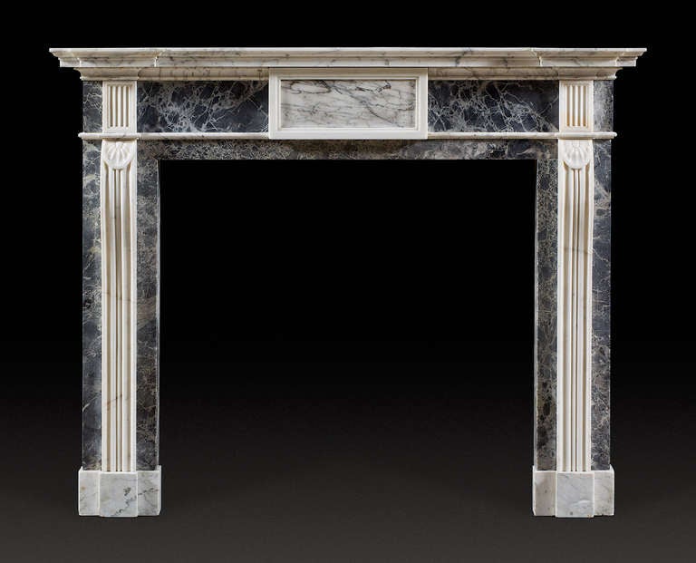 in Statuary, Old English and Dove Grey marbles. This mantel originally designed for Arthurstone house, Perthshire exhibits close similarities to an
Adam brother’s example in the North Drawing Room of Dumfries House. Dumfries House, designed by the
