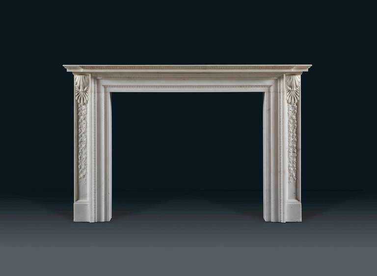 An exceptional quality late 18th century statuary marble chimneypiece in the manner of Sir John Soane (1753-1837) with typical low proportions, simple shelf, plain but attractive frieze and in grounds contrasting with the recessed jambs decorated