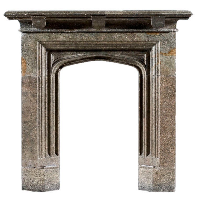 An antique 19th Century sandstone Gothic fireplace mantel