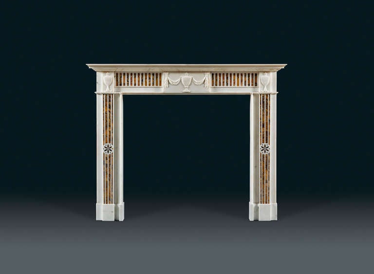 This Irish 18th century chimneypiece originally removed from the Duke of York’s house in Hyde Park Corner after its demolition in the 1960s.
This quintessentially Irish chimneypiece with undecorated tine mouldings; the overscale campana urns