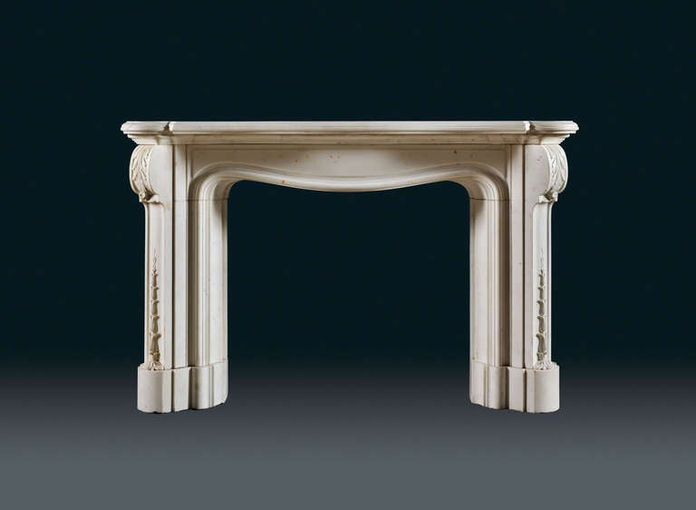 A statuary white marble chimneypiece designed by William Playfair, the moulded serpentine shaped shelf with crescented angled returns. Above a moulded and serpentine shaped frieze in both directions – on plan and as the top of the opening. The