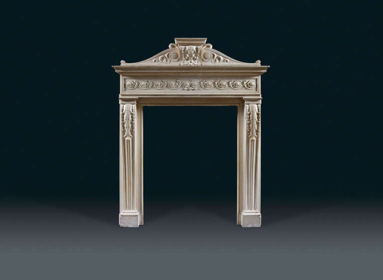 Designed with typical refined classicism of the period and carved with vigour subtlety and elegance in honey colored Caen stone. Late 19th century, early 20th century.

The frieze decorated with a contra Vitruvian scroll with acanthus leaves, the