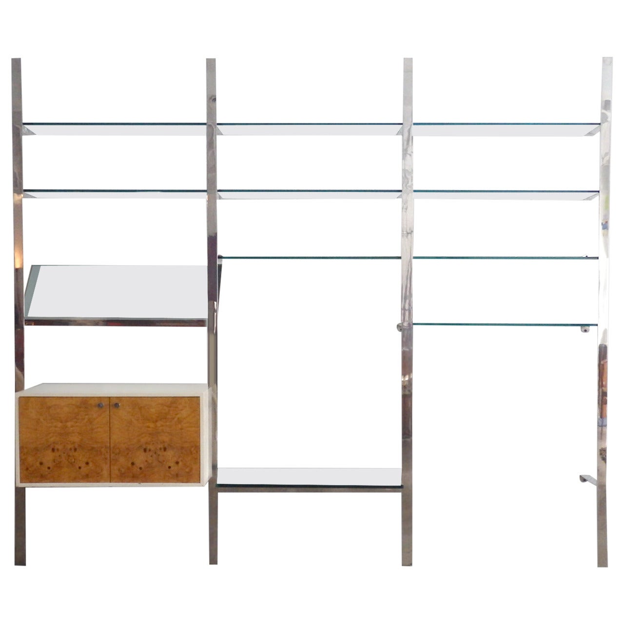 Pace collection wall mounted shelf unit . Two white lacquered cabinets with blonde burl wood doors anchor nine 12