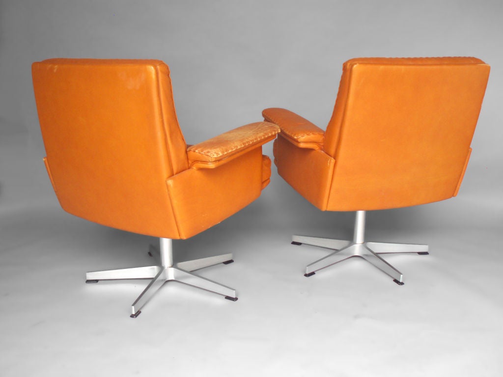 Pair of Leather Swivel Client Lounge Chairs by DeSede Switzerland Imported by Turner.