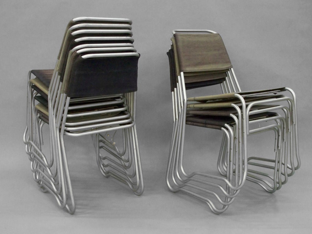 Set of 16 Aluminum Frame with Canvas Stack Chairs by Jack Heaney for Treitel-Gratz. Distributed by Herman Miller . This chair is In the Permanent MOMA Collection . Also displayed in the 1949 Detroit Institute of Arts for modern living show .