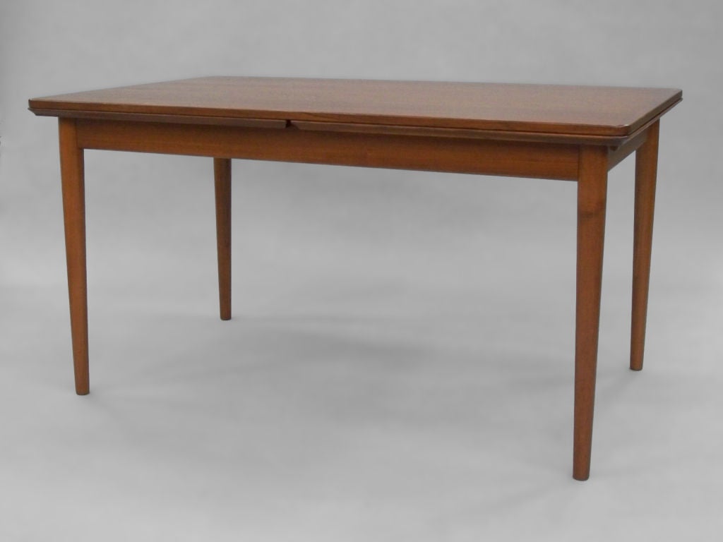 Teak dining table. Two 27