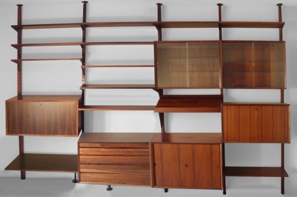 The Best Rosewood Cado Shelf Storage Wall Unit by Poul Cadovius Sold Through Heals England. Complete Large Five Pole System. Contact for Inventory of Components, Amazing Original Condition with Original Packing Boxes, Catalogue, Invoice and
