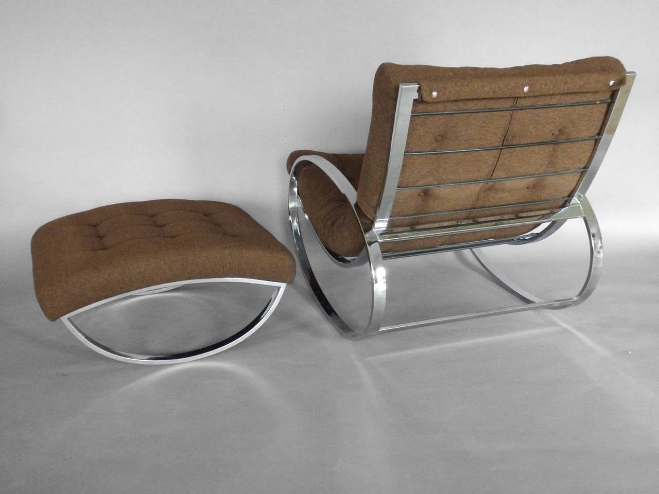 Chrome Tube Milo Baughman Style Rocker with Ottoman in Brown Boucle by Renato Zevi.
Chair: 27.5" wide x 38" deep x 32" tall
Ottoman: 27" deep x 25" wide x 19" tall