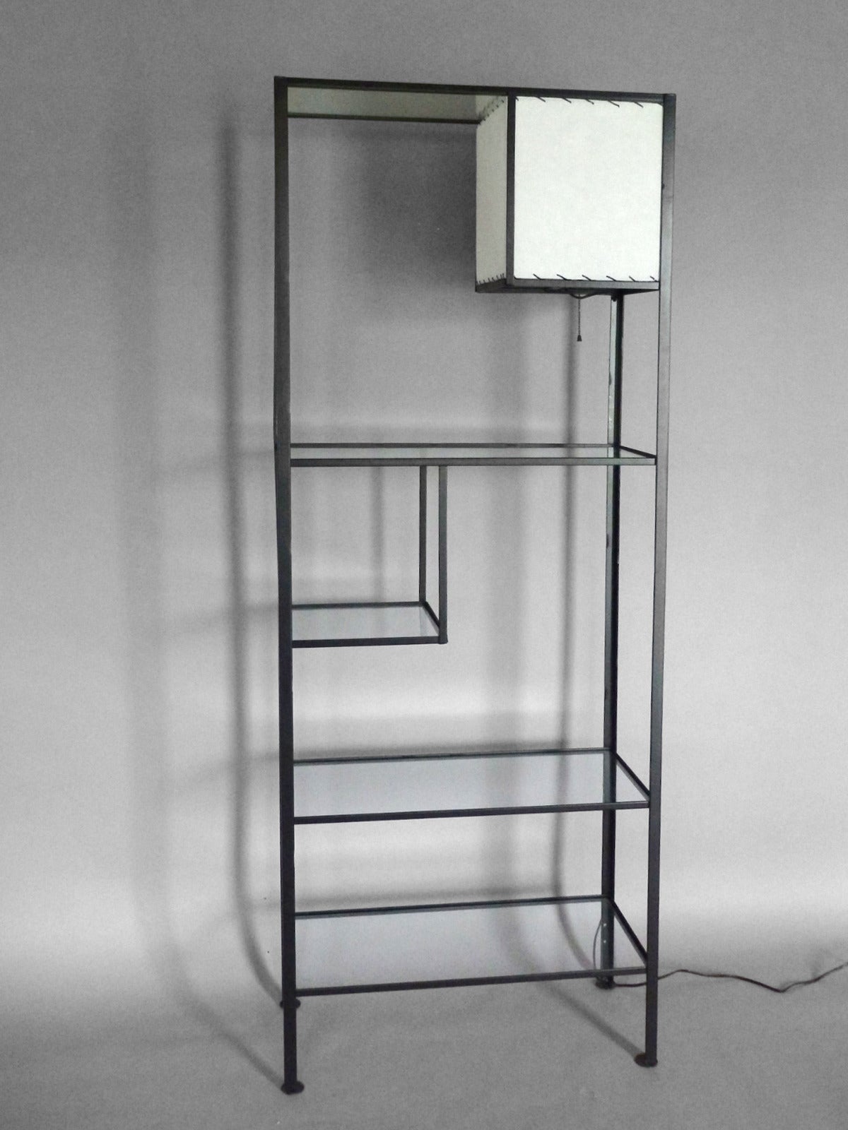 Frederick Weinberg iron and glass shelf unit with lamp.