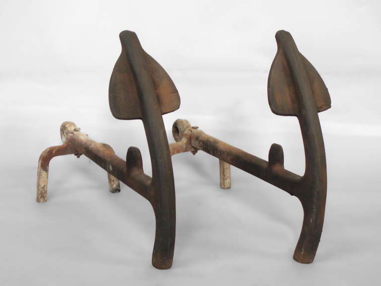  Heavy iron Fireplace andirons . Cast in the shape of anchors .  