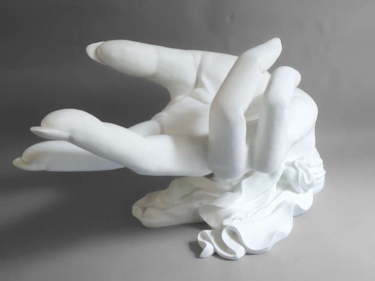 Large hand form resin cast sculpture. Works as a table base. There is no glass top included.