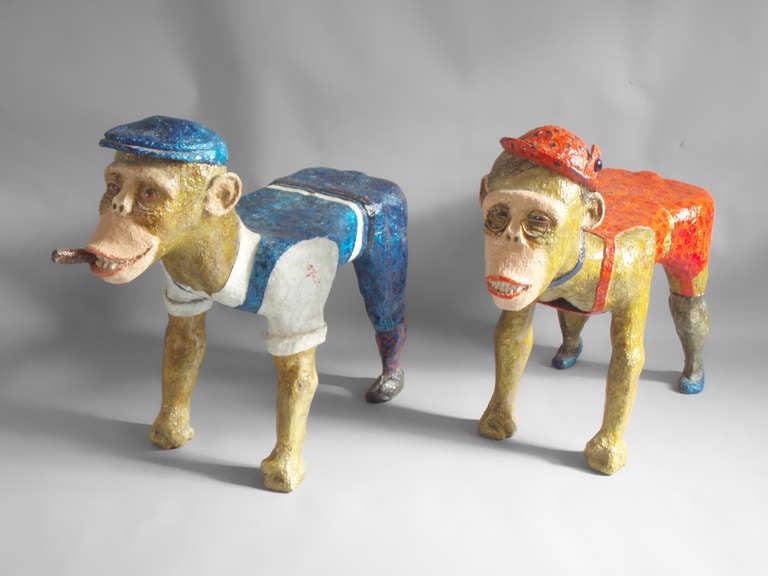 Pair of composition monkey benches or tables, signature looks like, a glasser.