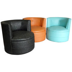 Three Barrel-Back Swivel Lounge Chairs