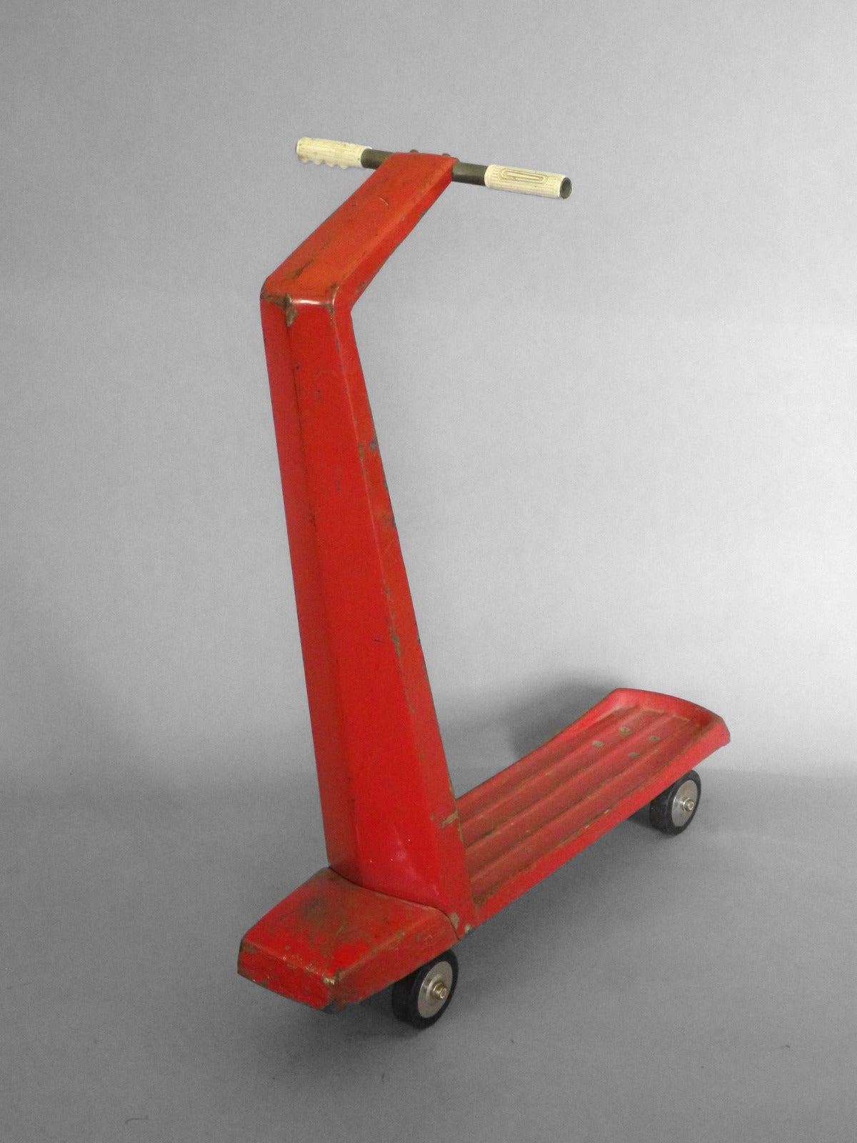 Child's Jet Age Modernist Scooter . Original red paint . There is label remnant intact . This will ship slightly disassembled . 