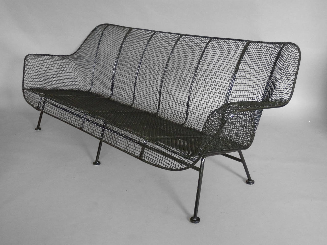 Wrought iron with mesh outdoor garden couch. Russell Lee Woodard for Woodard.
