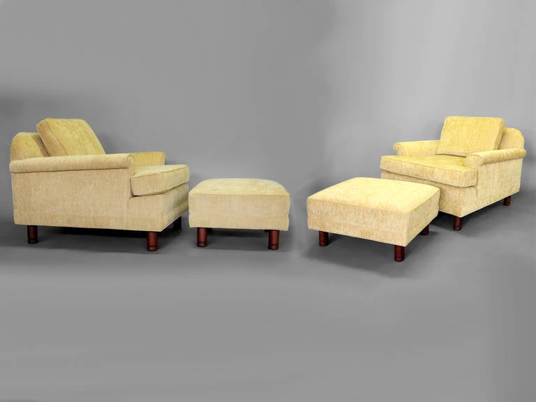Pair of Deep Low Lounge Chairs with Ottomans by the Selig Company .
Fresly upholstered . Ottomans each measure  26.5 wide - 21 deep - 12.5 tall