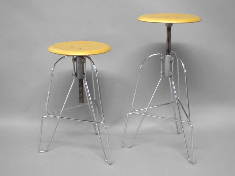 Pair of Industrial chic steel and wood adjustable bar stools by Jeffrey Corey. Measure: Height adjusts 25